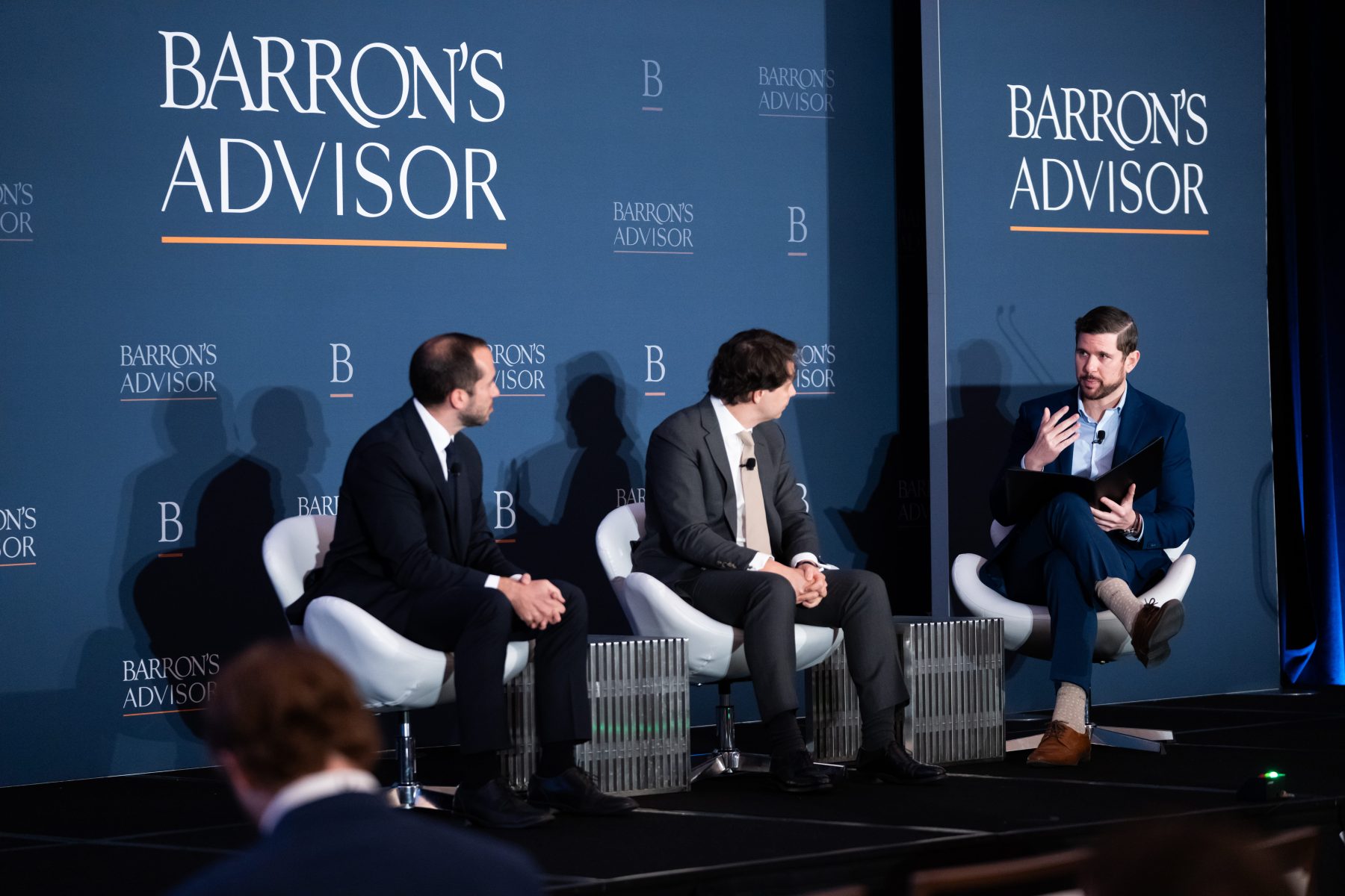 Andrew Goldberg moderating an alternatives panel at a Barron's Advisor event