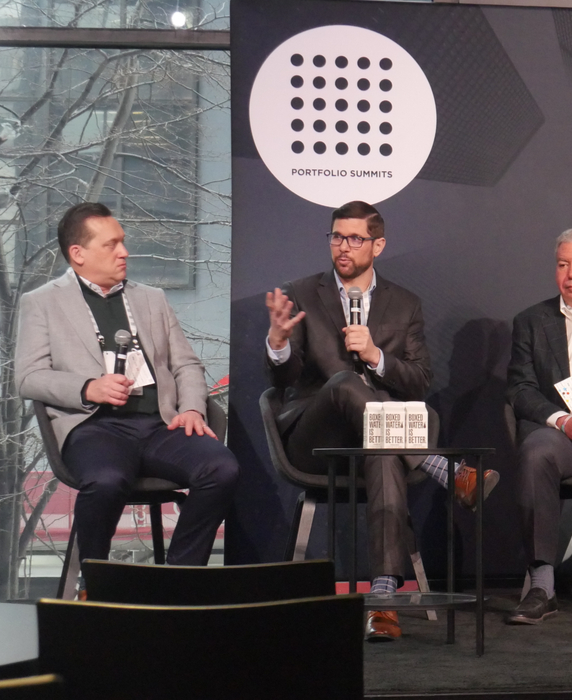 Andrew Goldberg speaking on a private markets panel at an industry conference